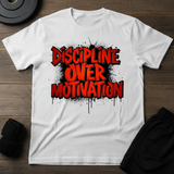Discipline Over Motivation T-Shirt featuring bold graffiti-style text on a white tee, perfect for fitness enthusiasts.